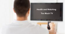 Health and Watching Too Much TV. Picture of a caucasian male watching TV and holding the remote.