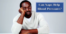Naps and Blood Pressure. Picture of a black male sitting at a table with his head resting on one hand, napping.