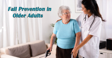 Fall Prevention in Older Adults. Picture of an older caucasian female being helped with her walker by a young caucasian female home health caregiver.
