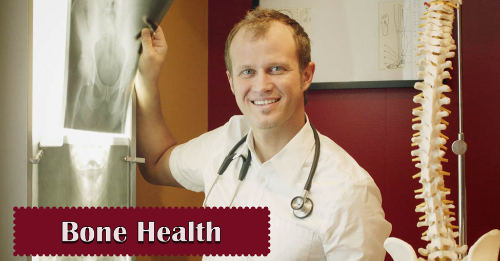 Bone Health Tips. Picture of a caucasian male doctor looking at xrays.