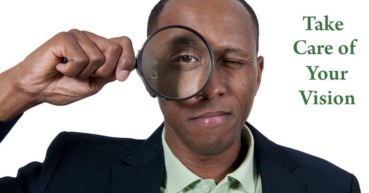 Caring for Your Eyes and Vision. Picture of a young black male holding a magnifying glass up to his eye.