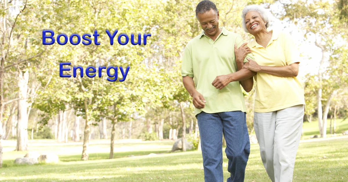 Boosting Your Energy: Simple Lifestyle Changes Combat Fatigue. Picture of an older black male and an older black female walking outside in a park.