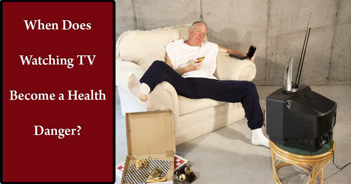 How Much Is Too Much When Watching TV? Picture of a middle aged caucasian male sitting on the couch in front of the TV eating pizza.