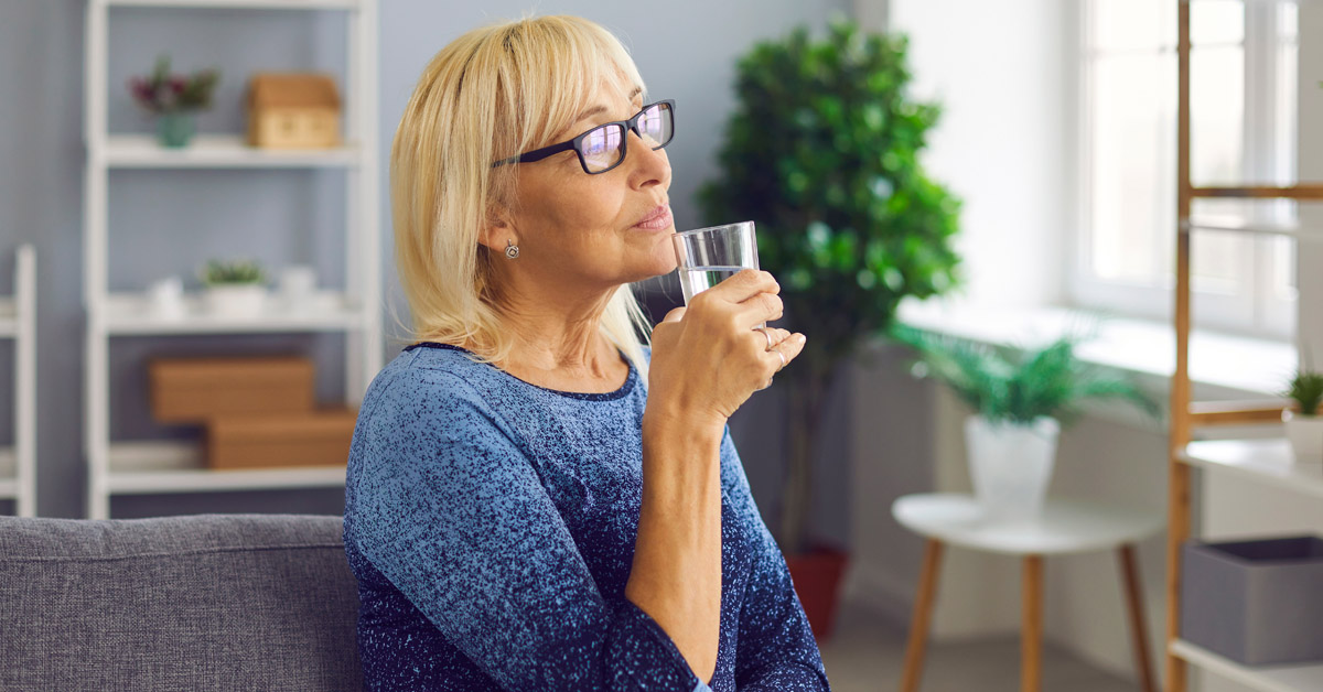 Lady enjoying a glass of water